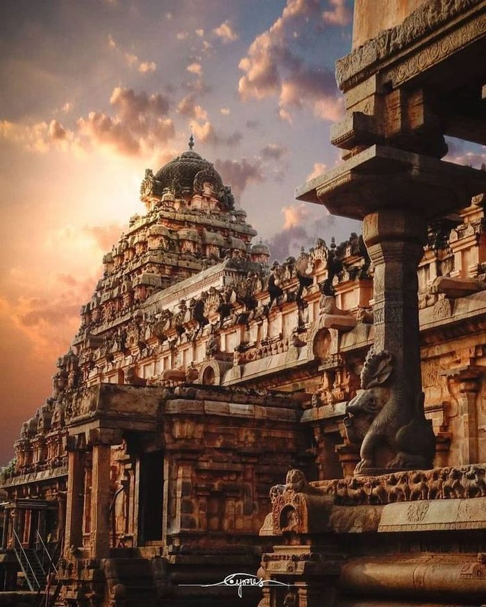 Temple gopuram carvings glowing at dusk